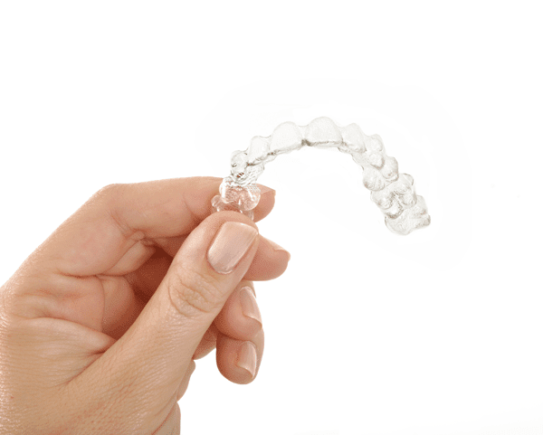 hand holding clear aligner, Roseville, CA