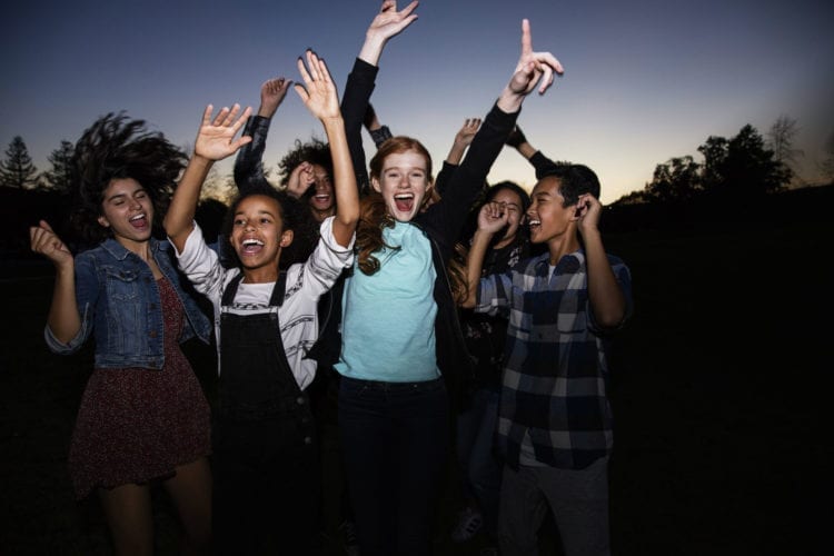teens dancing at dusk wearing Invisalign Teen