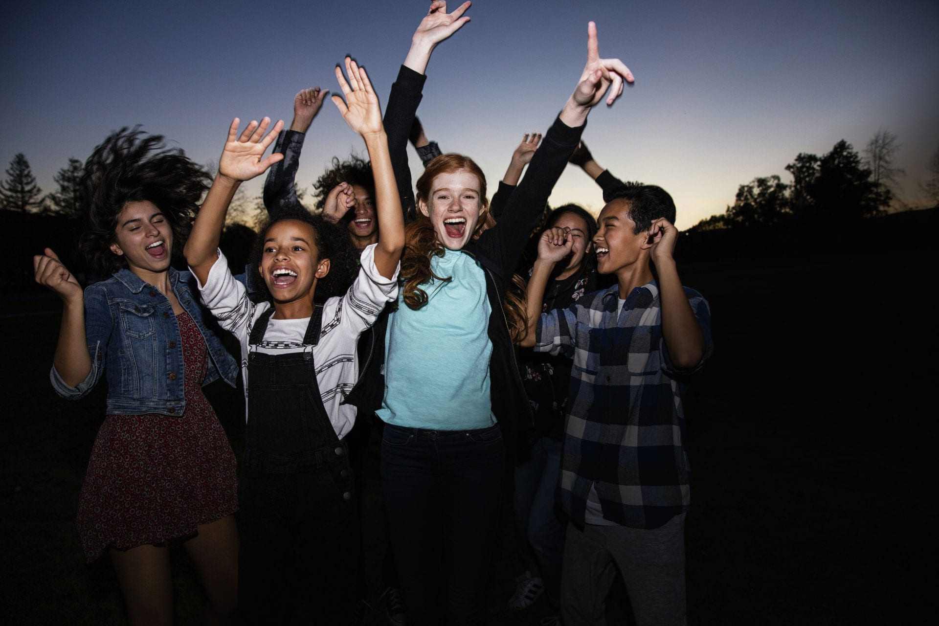 teens dancing at dusk wearing Invisalign Teen