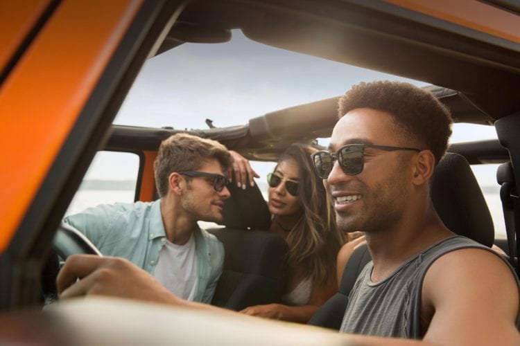 Group of friends riding in a Jeep