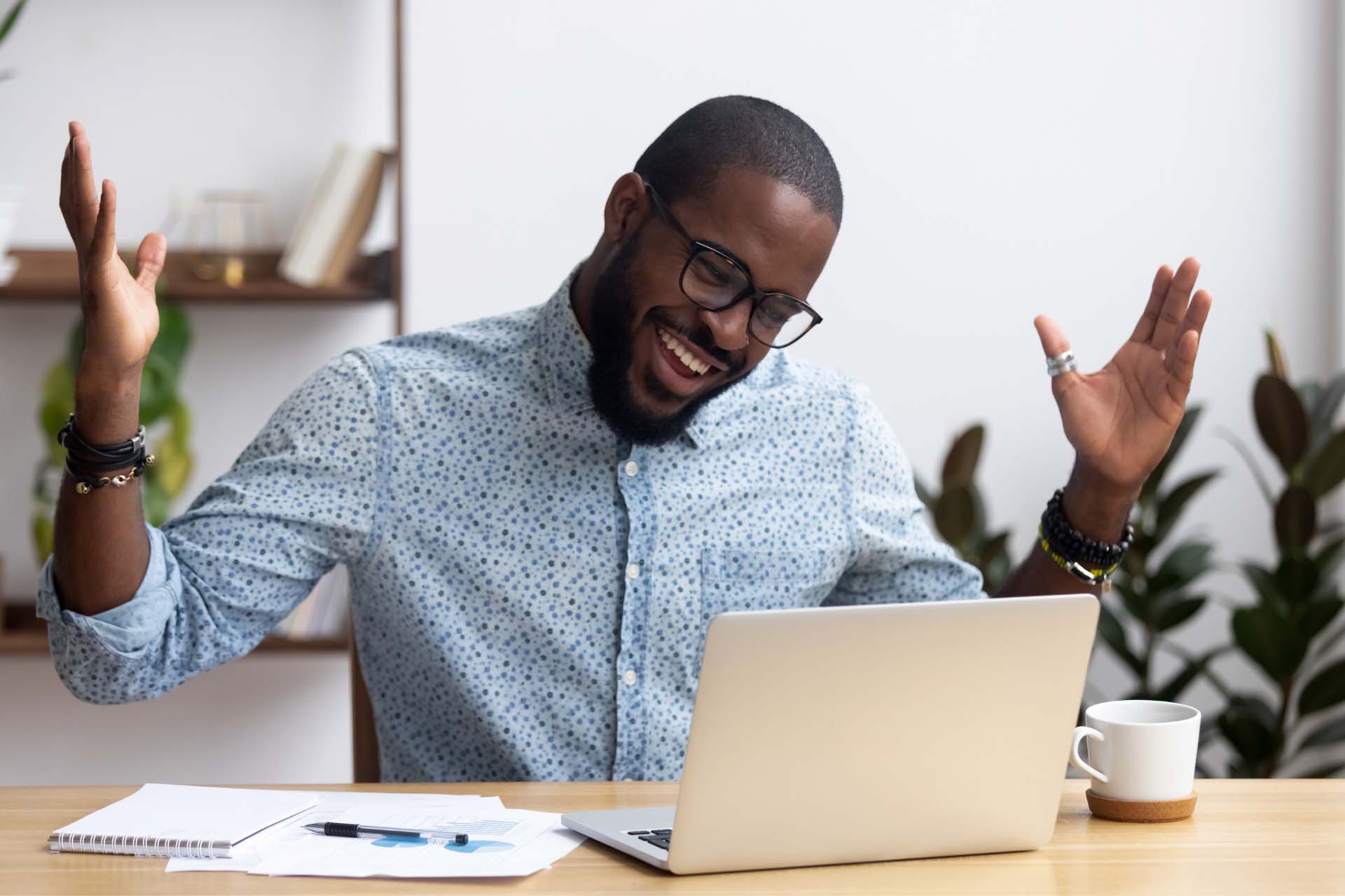 man confidently displays his great smile during an online meeting Man on video conference call while going through orthodontic treatment