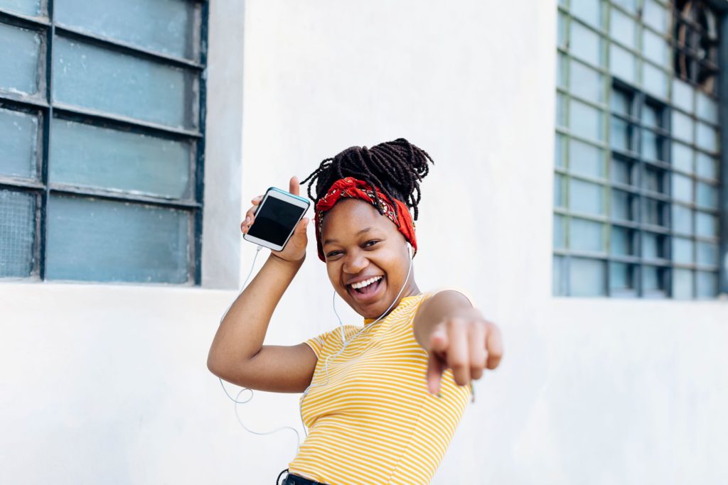 Happy teenager rocking clear aligners to straighten her teeth in Sacramento