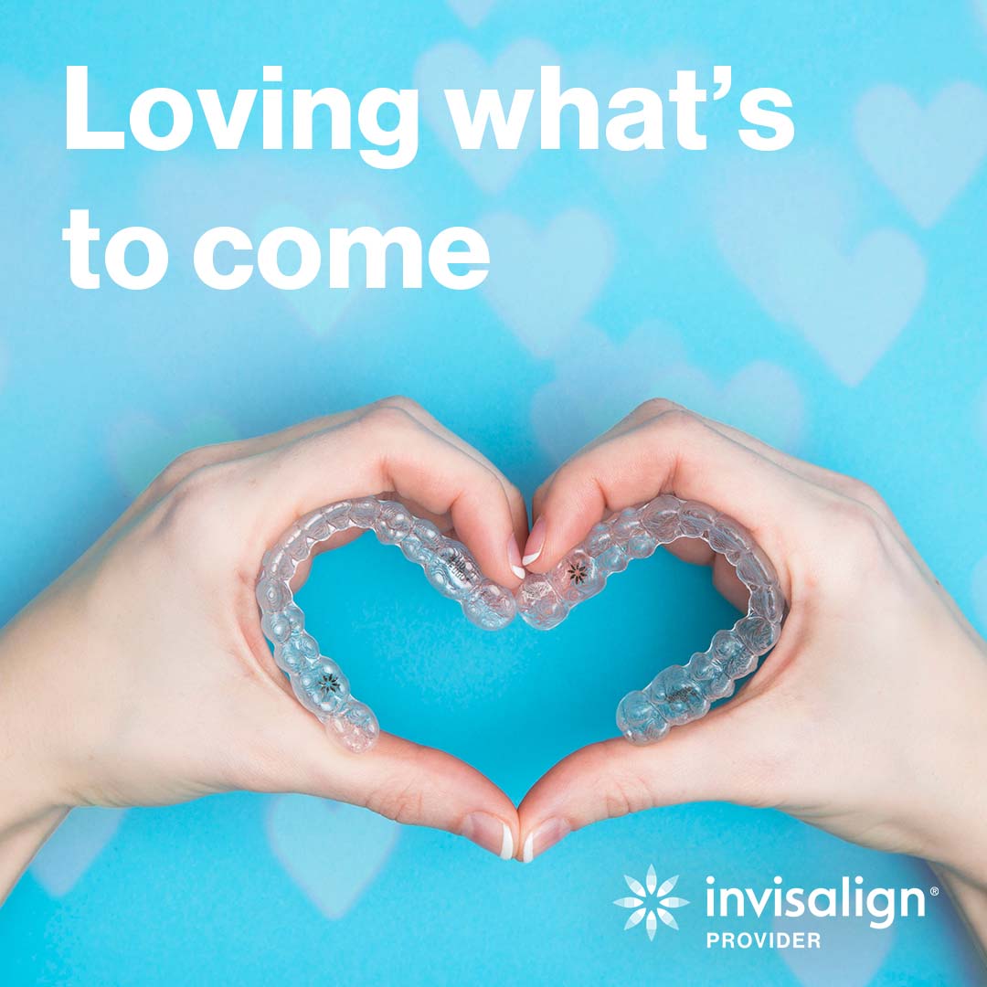 Invisalign – Loving what's to come. Woman's hands holding two Invisalign aligners in the shape of a heart