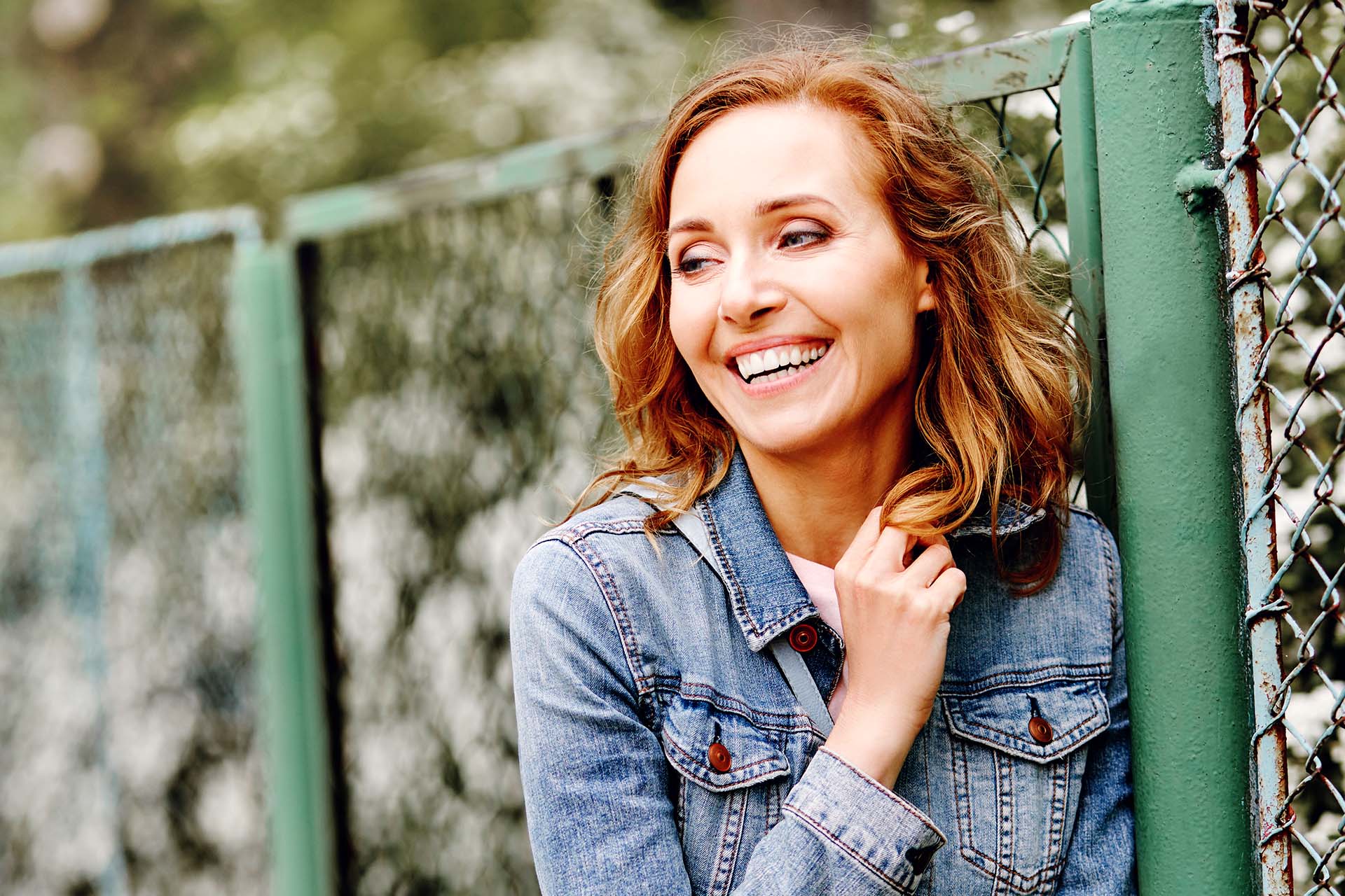 adult woman with a beautiful smile enjoying a spring day