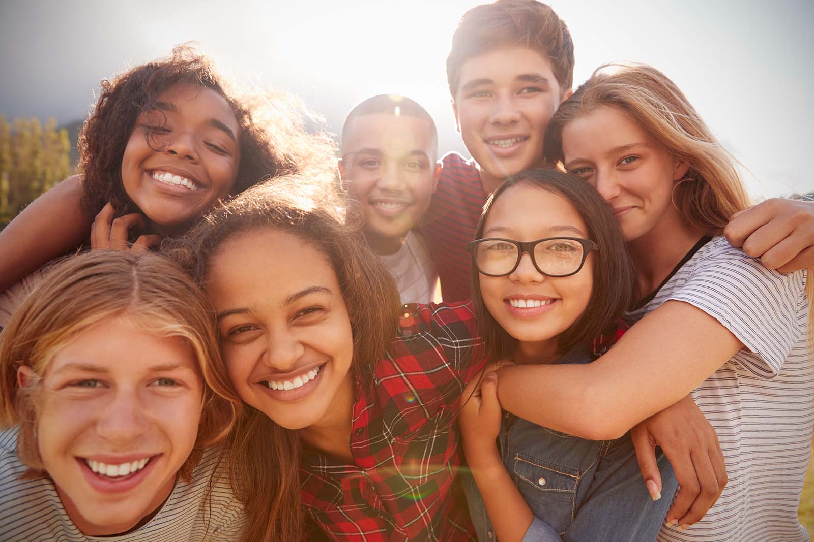 Make an appointment at American River Orthodontics teenage school friends smiling together