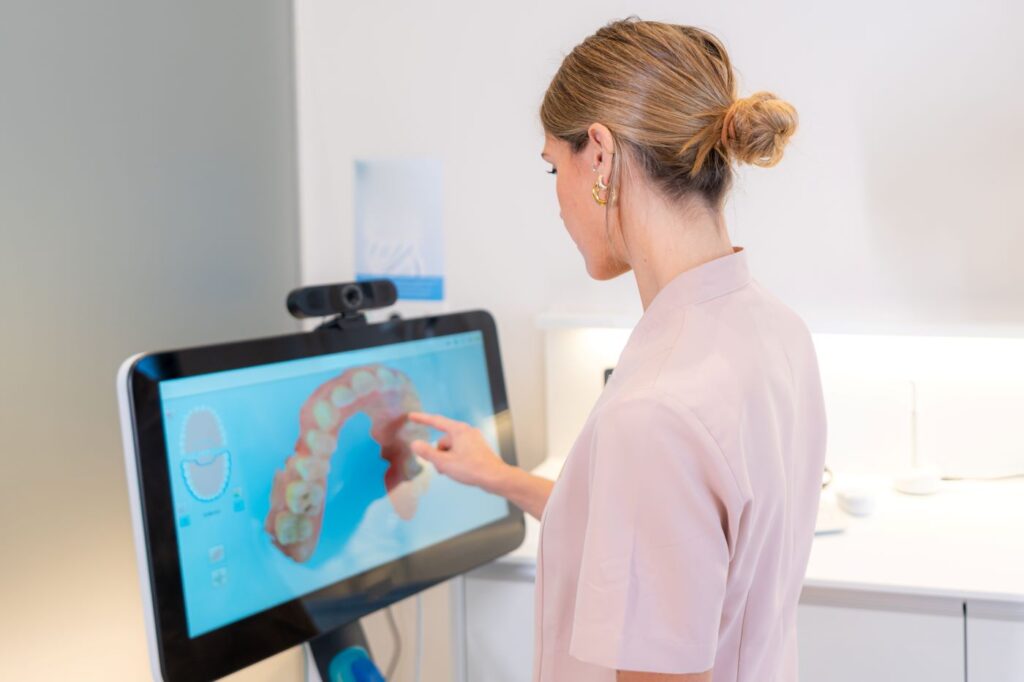 Invisalign doctor working on a digital treatment plan for Invisalign refinement for a perfect smile